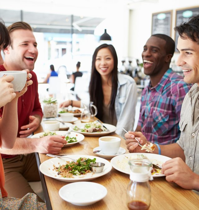 a bunch of people making friends at lunch