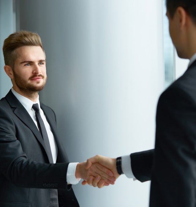 Business People. Successful Business Partner Shaking Hands in th A man of integrity shaking hands with another man