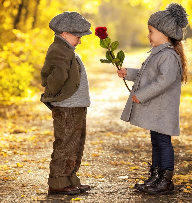 boy flirting with girl with an assumption she'll like the flower